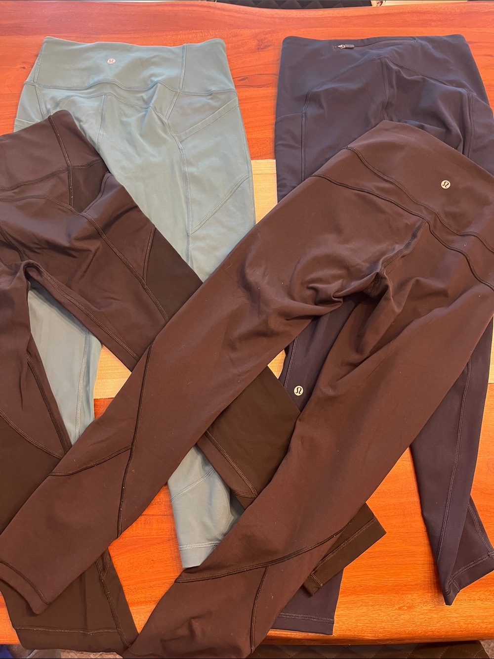 4 pairs of Lululemon athletica leggings in light green, navy, and black size 6